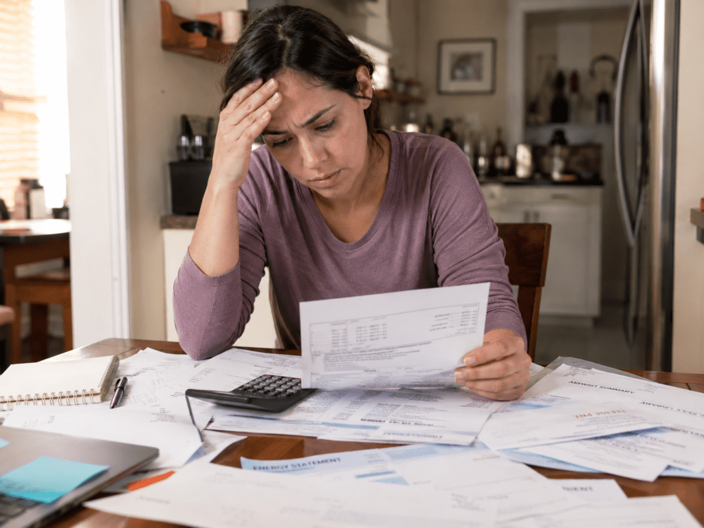 Person weighing debt consolidation vs bankruptcy options in Canada